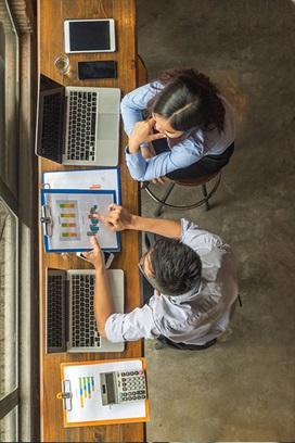 people at desk with computers